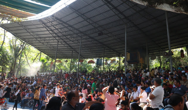 The audience anticipating the orangutan show at Safari world, Thailand.